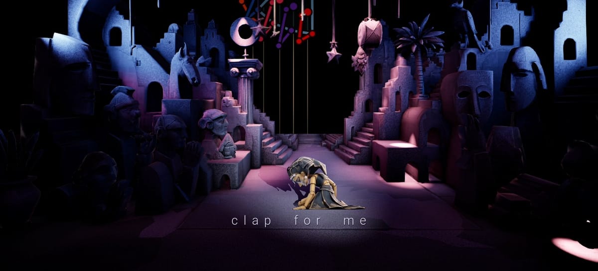 The CLAP FOR ME character kneeling in a spotlight during the installation
