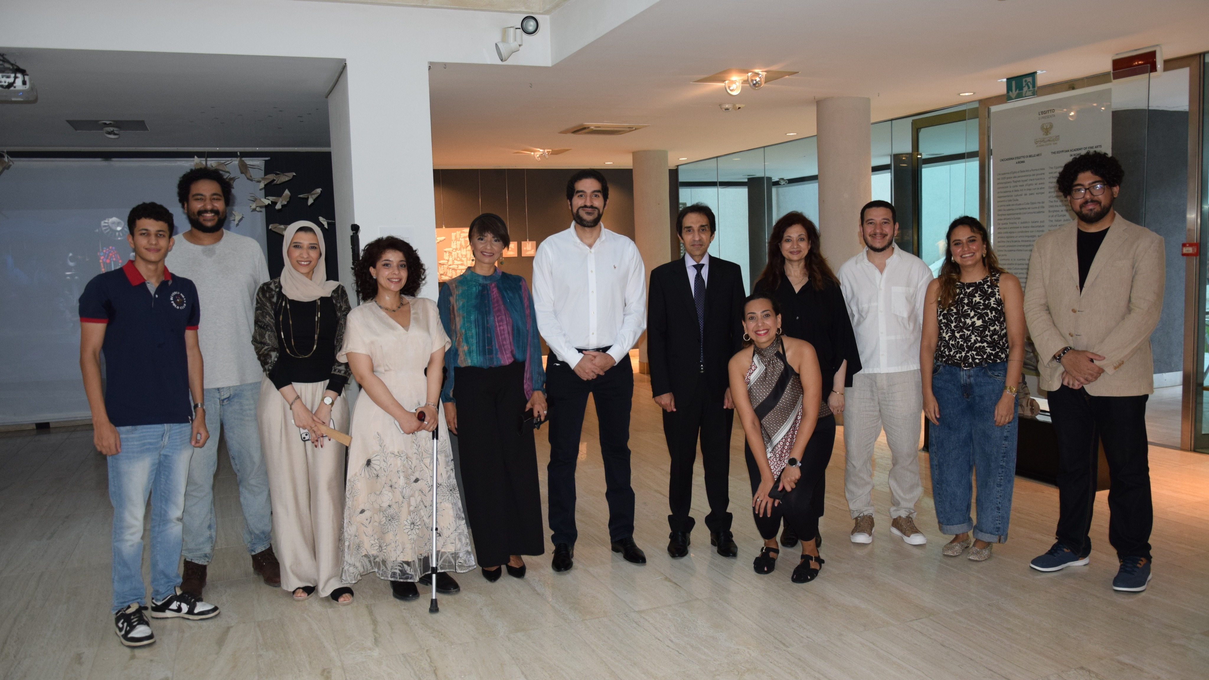 Mariam Ashraf, leaning on a walking cane, with fellow State Award artists and Egyptian Academy staff at the Rome exhibition opening